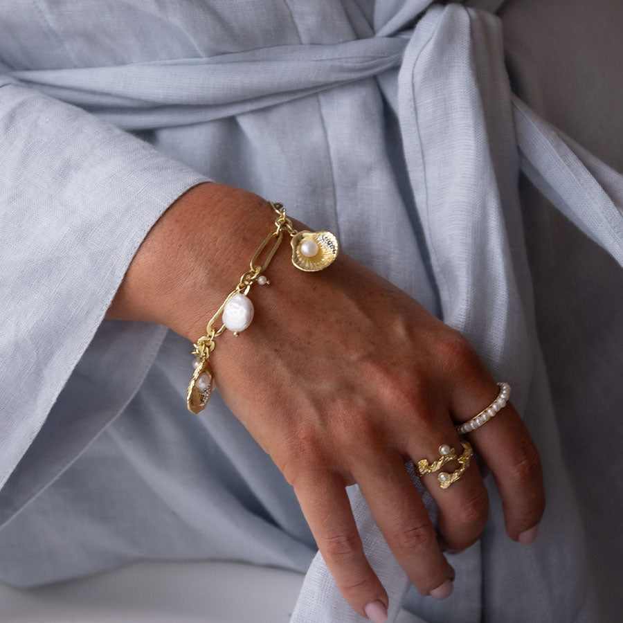 The world is your oyster pearl charm bracelet