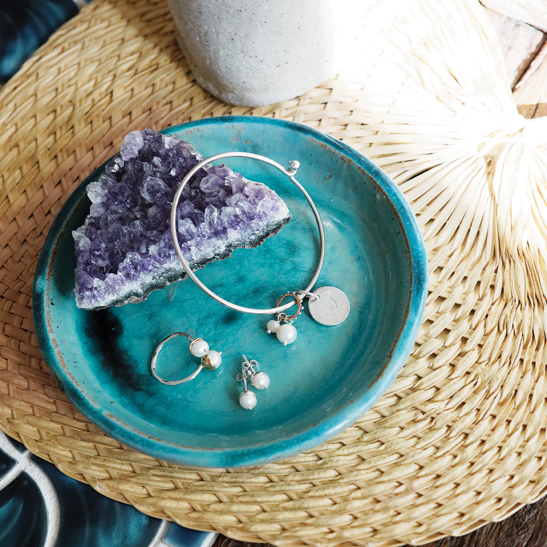 Double pearl charm on ring