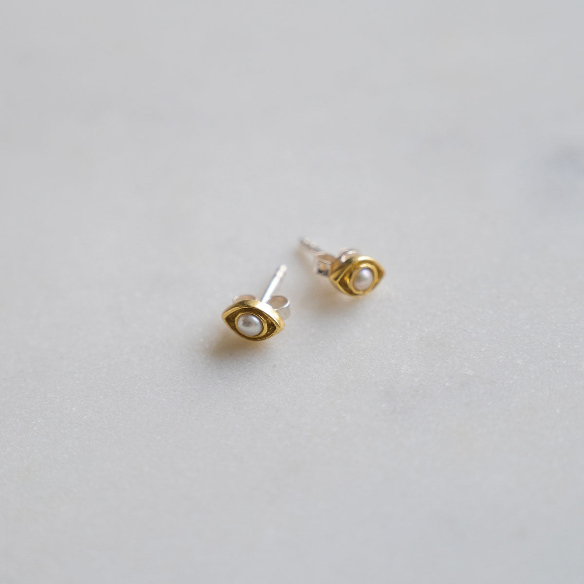 Evil eye pearl stud earrings