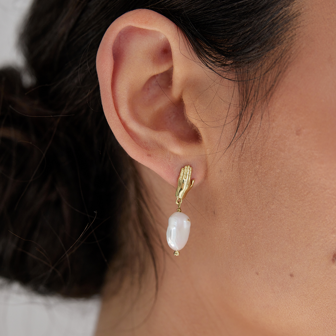 Aristotle hand and pearl earrings